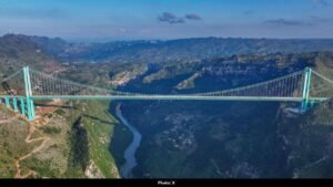 China Opens World’s Tallest Bridge, Travel Time Slashed