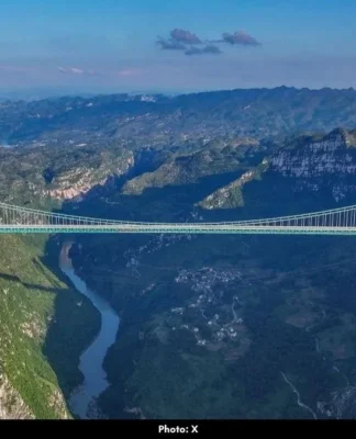China Opens World’s Tallest Bridge, Travel Time Slashed